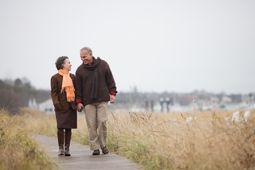 Couple walking in fields